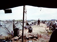 A bunch of miserable troops in the hot sun at Saigon University, our first camp in Vietnam.  We were each given only three  rounds in case we were attacked by the VC.  The Mother Hunter, Bn XO (as I remember), did not want us to get too enthusiastic returning fire and hurt ourselves.